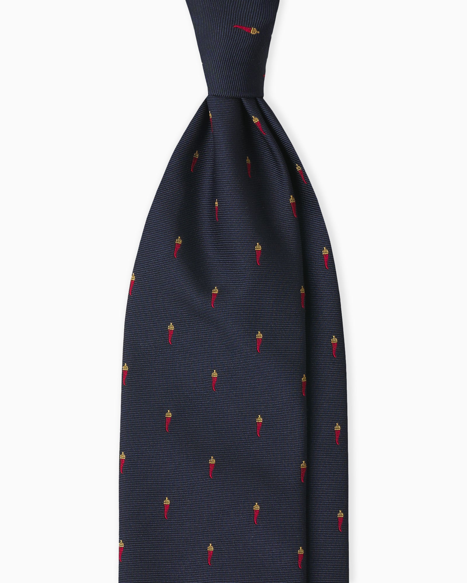 Cravatta su misura in seta jacquard blu con cornetti napoletani fatta a mano in Italia