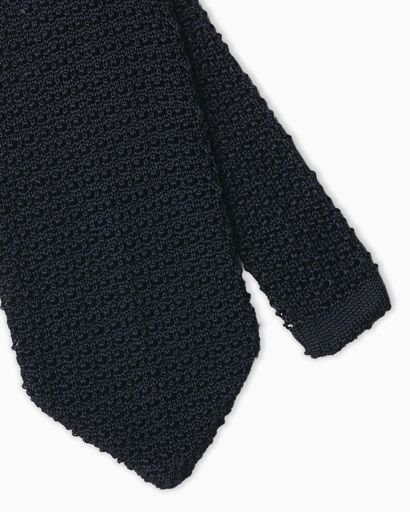 Navy blue knitted tie crafted in Italy with crochet weave and V-end shape