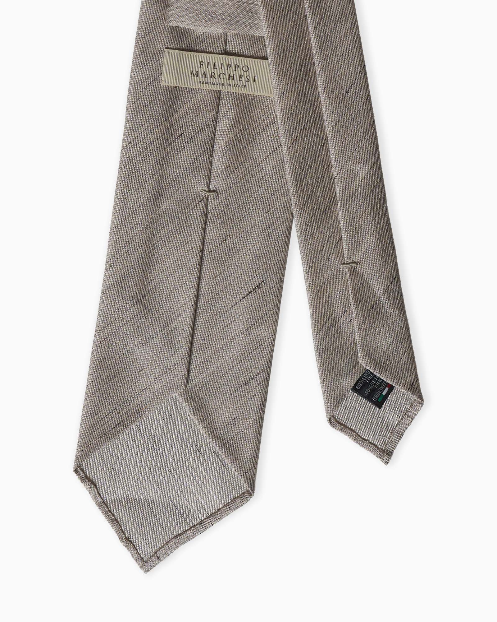Medium beige artisanal unlined silk linen tie with natural texture