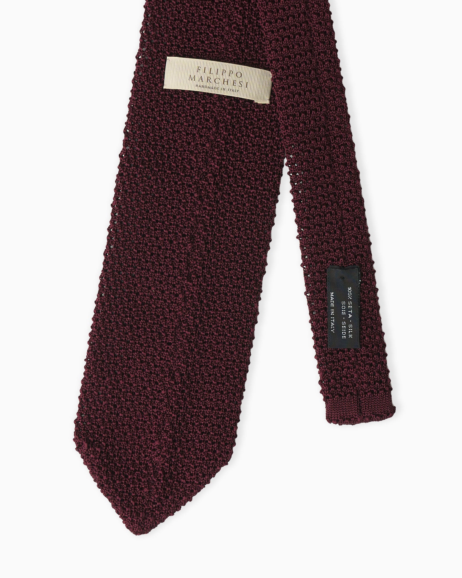 Burgundy knitted tie crafted in Italy with crochet weave and V-end shape