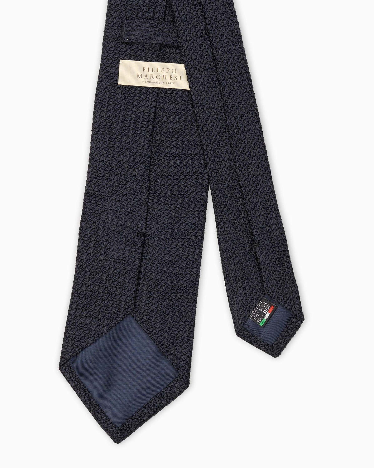 Cravatta in seta blu con trama grenadine a garza grossa.